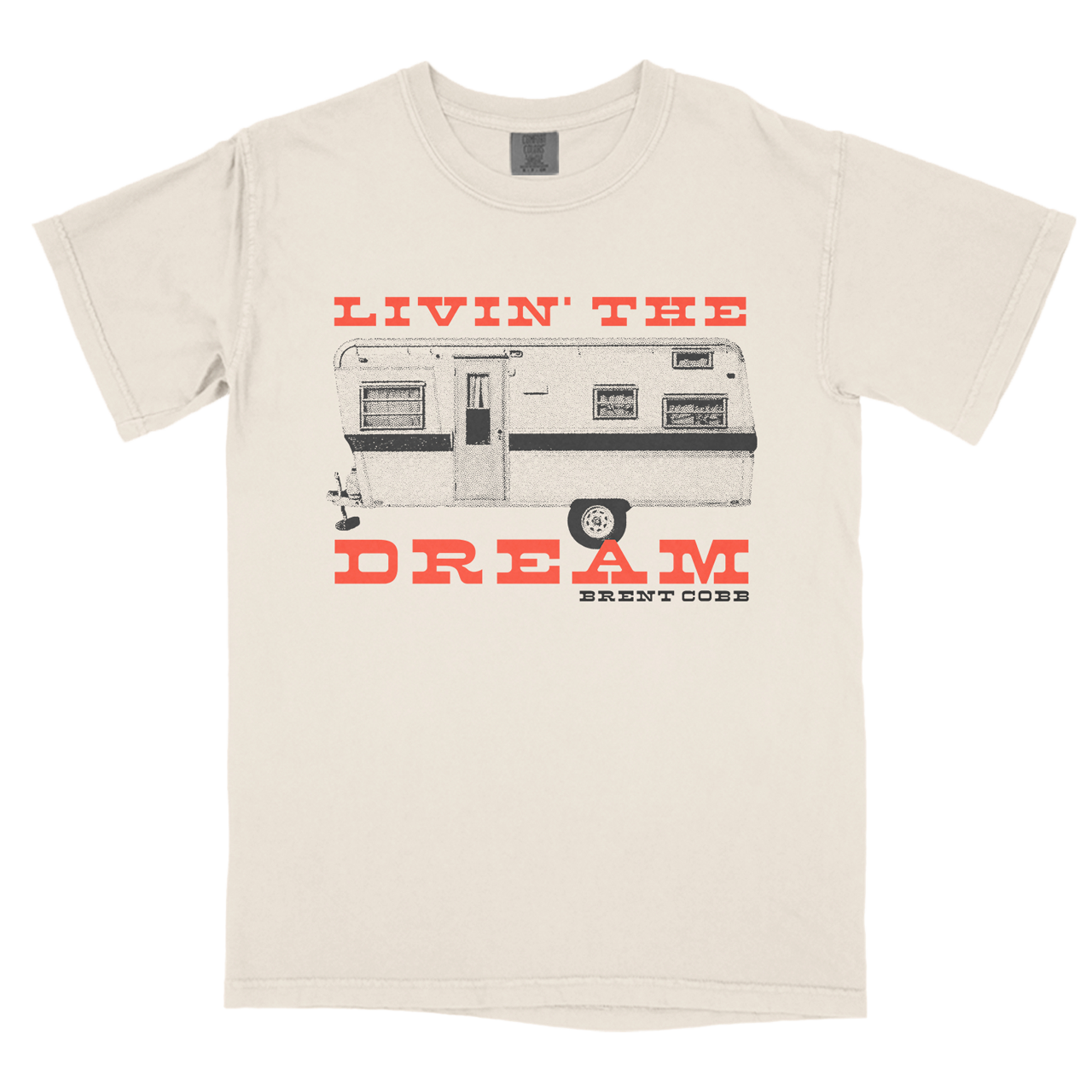 white tee with orange text that reads "Livin' The Dream" and black text that reads "Brent Cobb", with camper graphic